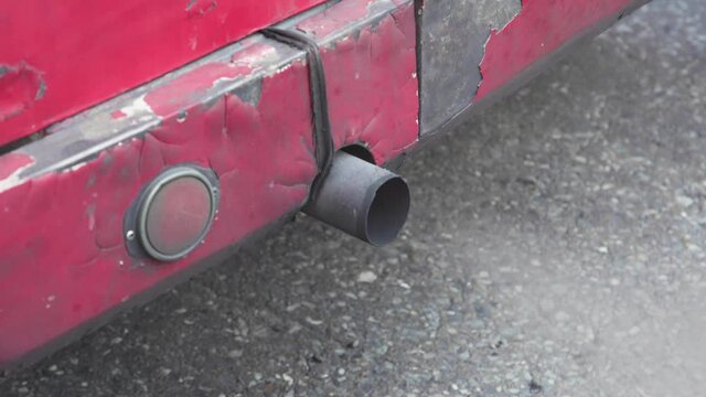 Close up of exhaust fumes from the exhaust pipe, The exhaust gases of the car bus white thick smoke from the chimney, pollution ecology.