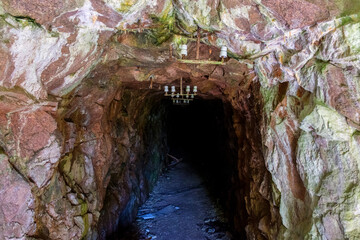 Dark old mine carved in the mountain