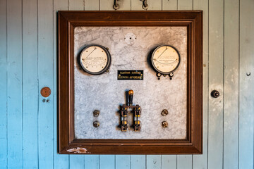 Old electrical instruments on a marble panel