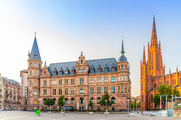 Naklejka premium Wiesbaden cityscape with City Palace Stadtschloss or New Town Hall Rathaus and Evangelical Market Protestant church or Marktkirche on Market Square in historical city centre, State of Hesse, Germany