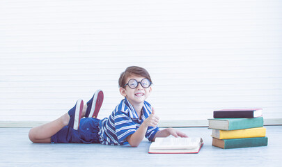 Little boy is reading books.