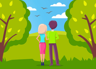 Man and woman, couple in love walking in green city park and looking far away at birds flying in the blue sky. Romantic relationship, date on nature, girl and guy, dating or romance, lovers back view