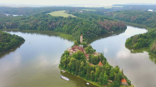 Aerial view on czech medieval castle Zvikov, situated on rocky outcrop above the confluence of two rivers Vltava and Otava, Czech republic
