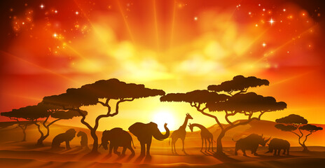 Fototapeta na wymiar An African savannah landscape scene with safari animal silhouettes