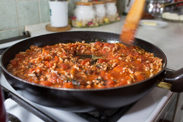 Preparation of lasagne.