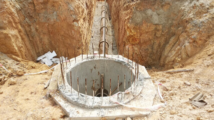 SEREMBAN, MALAYSIA -MARCH 10, 2020: Utility services manhole and underground pipes under construction at the construction site. In-situ construction by workers based on infrastructure engineer design.