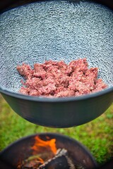 Chopped meat in a fire bowl