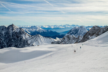 ski slope and panorama of the snowy alps from the ski resort