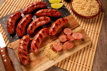 Grilled sausage. Grilled Sausage on wooden board. Brazilian barbecue.