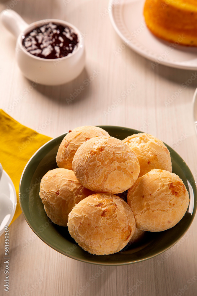 Wall mural brazilian cheese buns . table coffee in the morning with cheese bread in basket.