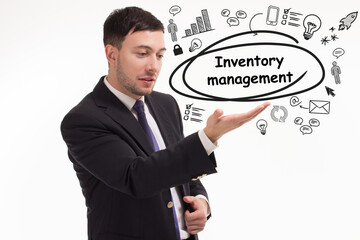 Business, technology, internet and network concept. Young businessman thinks over the steps for successful growth: Inventory management
