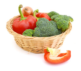 Broccoli , onion and slice red peppers in basket on white