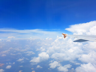 Sky and cloud as seen through window of an aircraft