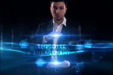 Business, Technology, Internet and network concept. Young businessman working on a virtual screen of the future and sees the inscription: Employee engagement