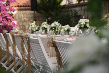 Fototapeta na wymiar Dining table chair flower decoration, chair decor