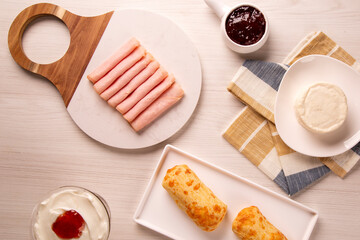 Cheese bread with cheese and ham on White marble background.