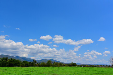 Blue skies, breathtaking beautiful mountain scenery with many clouds. Mountain height