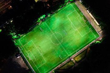 Evening football stadium in evening, aerial view from drone