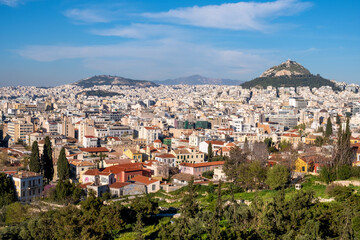 Fototapeta na wymiar Panoramic view of metropolitan Athens, Greece with Lycabettus Lycabettus hill and Pedion tou Areos park seen from Areopagus rock