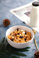 Cereal dessert with corn oat and dry fruits isolated in blue background