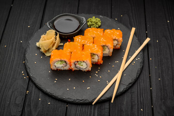 Philadelphia roll with fresh fish on black background