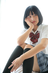 Portrait japanese school girl in white tone bed room