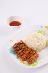 Thai food gourmet fried chicken with rice , khao mun kai in wood background
