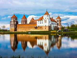 Naklejka na ściany i meble amazing Mir Castle reflected in the lake, Belarus