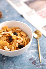 Cereal dessert with corn oat and dry fruits isolated in blue background