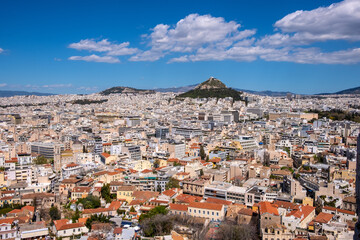 Fototapeta na wymiar Panoramic view of metropolitan Athens, Greece with Lycabettus Lycabettus hill and Pedion tou Areos park seen from Areopagus rock