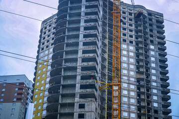 Modern new multi-storey building under construction in the city