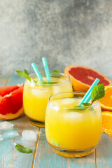 Summer menu drink. Orange and Grapefruit  refreshing drink with ice. Copy space.