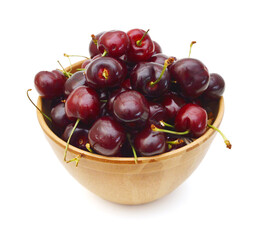 Cherry in wooden bowl isolated on white background