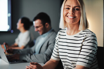 Businesswoman smiling during a meeting