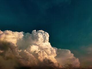Large white reddish clouds at sunset