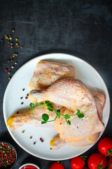 chicken meat legs fillet Menu concept camembert or brie serving size. food background top view copy space for text organic healthy eating keto or paleo diet