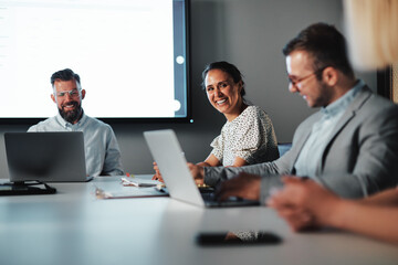 Businesswoman laughing during a presentation