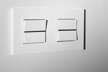 Light switch with two button on white background.