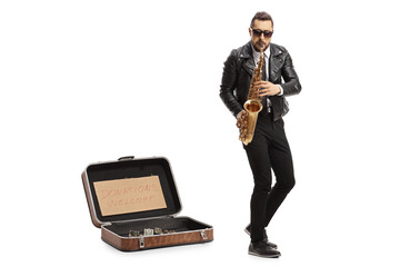 Naklejka premium Man playing a saxophone with a suitcase for donations