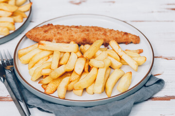 Traditional English Food such as Fish and Chips with green peas served in the Pub or Restaurant