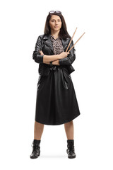 Fototapeta premium Female drummer holding a pair of drumsticks