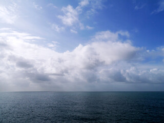 maritime landscape with sea and blue sky and clouds in the bay of Cadiz capital. Andalusia. Spain. Europe.
