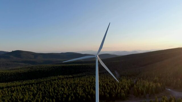 Giant wind energy converter sitting high above the valley.