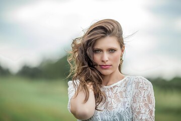 Portrait of a young beautiful woman. Beautiful young green-eyed girl on the nature.