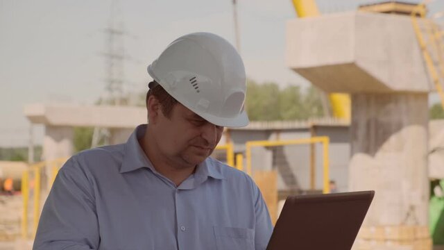 Dissatisfied inspector inspects the construction site. supervisor identifies violations and problems during construction work.