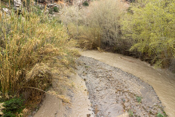 cloudy water going down the river
