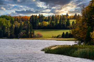 A river running through a fall landscape in rural Prince Edward Island, Canada.