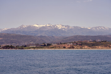 Rocky sea coast of Crete, Greece on a sunny day with clear sky.