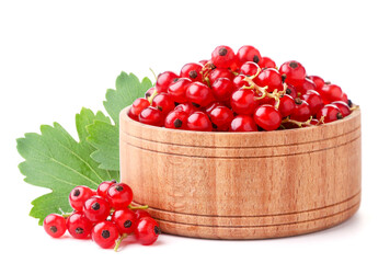 Red currants in a wooden plate on a white background. Isolated