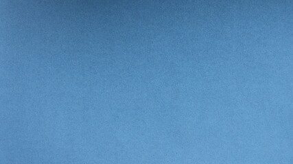 plain blue background with a light grainy dotted structure and a flat surface as the basis for design and creativity